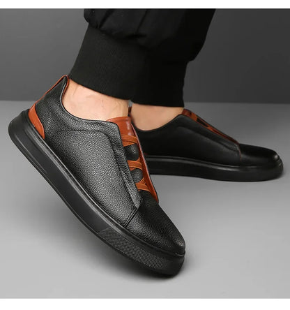 Front view of men's modern sneakers, showcasing effortless style & comfort for street fashion.