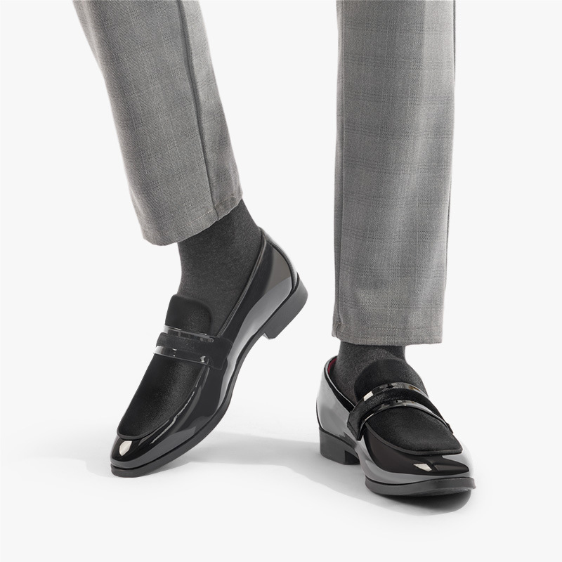 Black slip-on men's dress loafers, elegant formal footwear for professional or special events.
