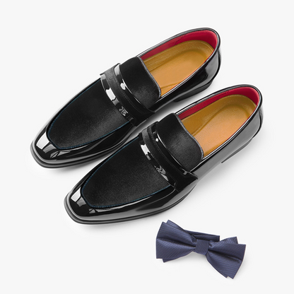 Front view of classic men's black dress loafers, sophisticated formal footwear for professional or event wear.