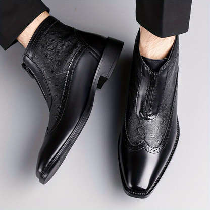 Elegant black men's footwear: front zip ankle boots with a sleek silhouette.