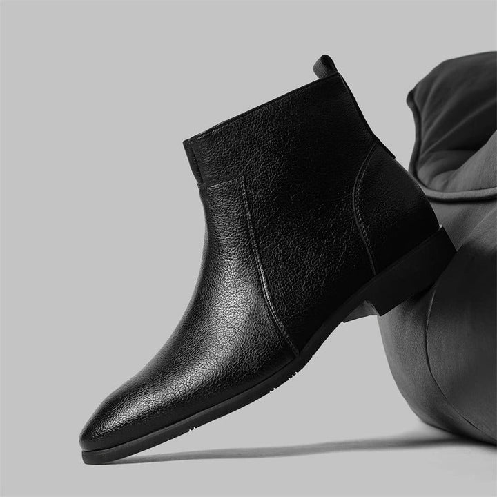 Contemporary men's dressy ankle boots featuring a sleek side zip & refined pointed toe.