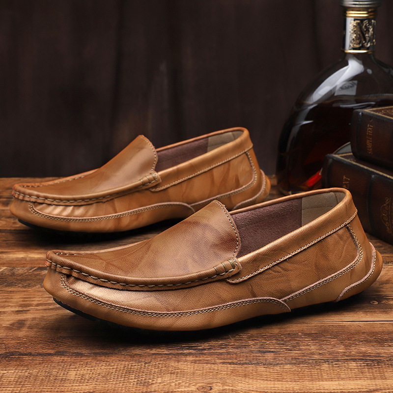 Close-up of men's sleek brown leather loafers, highlighting the quality material & comfortable design.