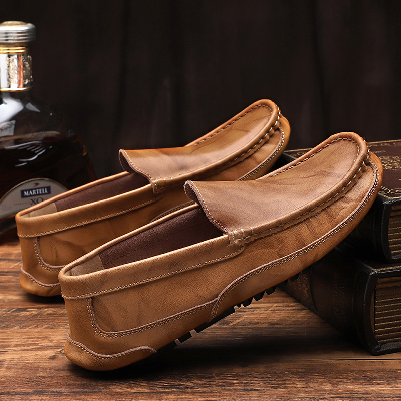 Side view of men's comfortable brown slip-on loafers, showcasing the elegant design and durable sole.