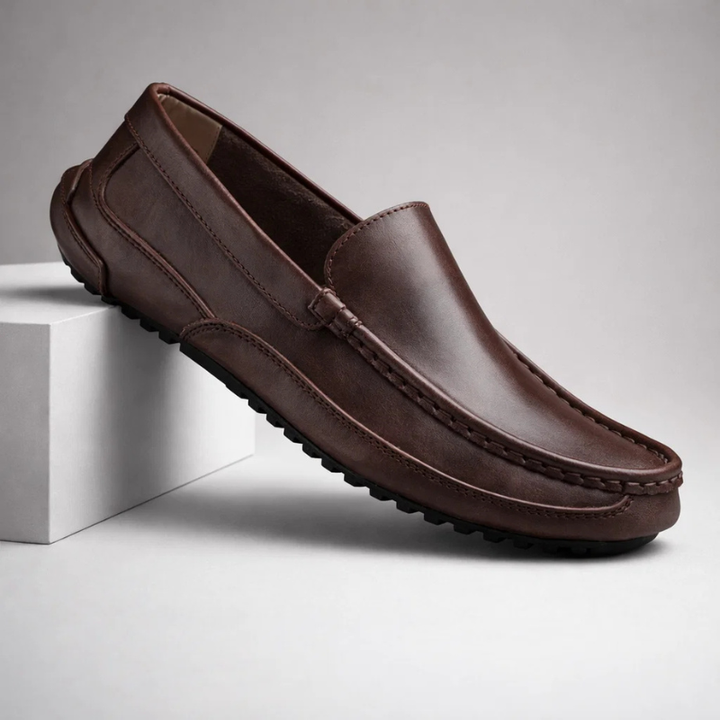 Man wearing stylish brown leather loafers, ideal mens footwear for everyday comfort & versatile wear.
