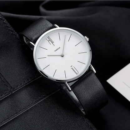 Classic men's dress watch, minimalist dial, smooth black leather strap, polished stainless steel.