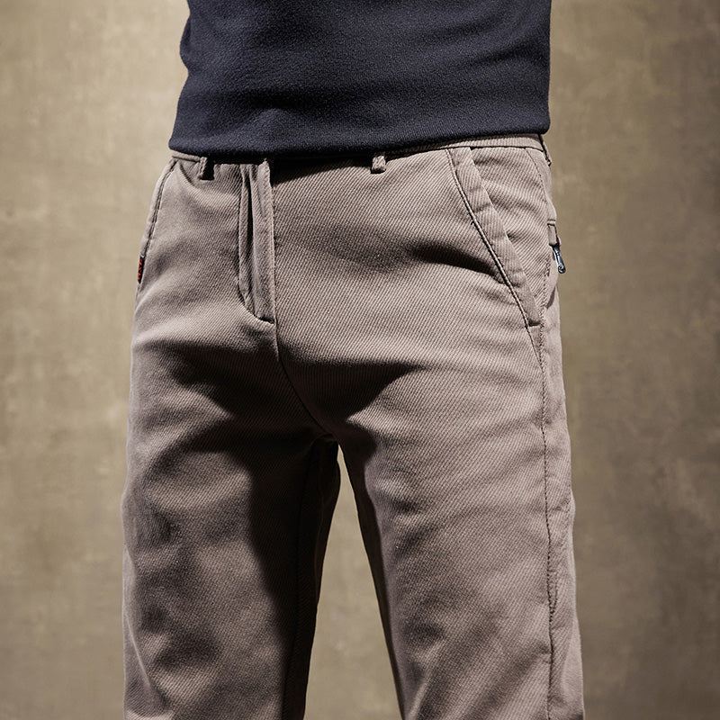 Gray men's slim fit trousers, sleek and wrinkle-resistant for a modern office style and professional look.