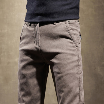 Gray men's slim fit trousers, sleek and wrinkle-resistant for a modern office style and professional look.