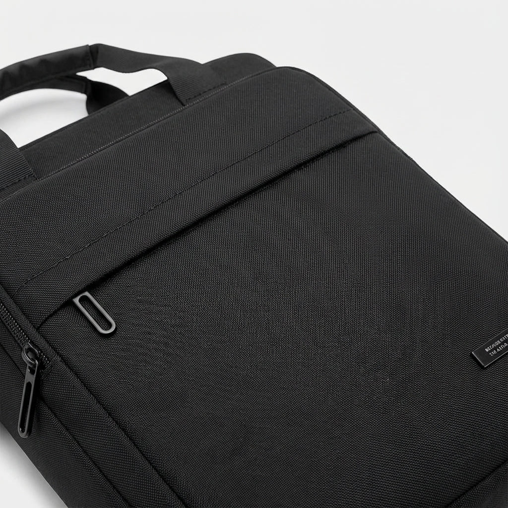 Sleek men's slim business messenger bag. Durable nylon, perfect for professional laptop and travel organization.