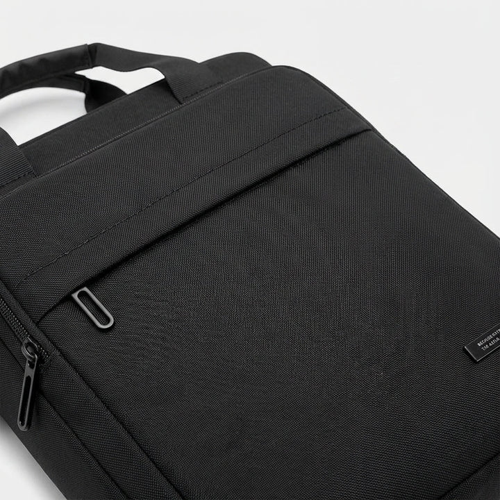 Sleek men's slim business messenger bag. Durable nylon, perfect for professional laptop and travel organization.