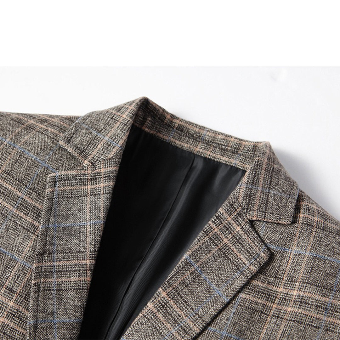 Man confidently posing in a smart casual embroidered slim fit blazer, perfect for modern men's fashion events.