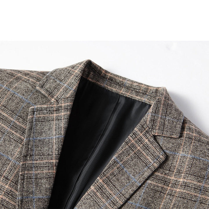 Man confidently posing in a smart casual embroidered slim fit blazer, perfect for modern men's fashion events.
