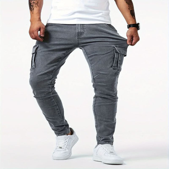 Modern men's slim fit multi-pocket cargo jeans, durable denim for a comfortable and stylish look.