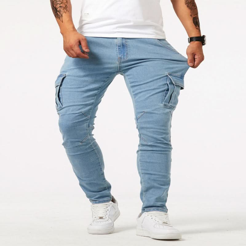 Close-up of side pockets on men's slim fit cargo jeans, highlighting utility design & durable denim.