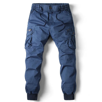 Stylish men's blue slim fit cargo pants with utility pockets. Ideal for casual fashion, outdoor activities, & versatile styling.