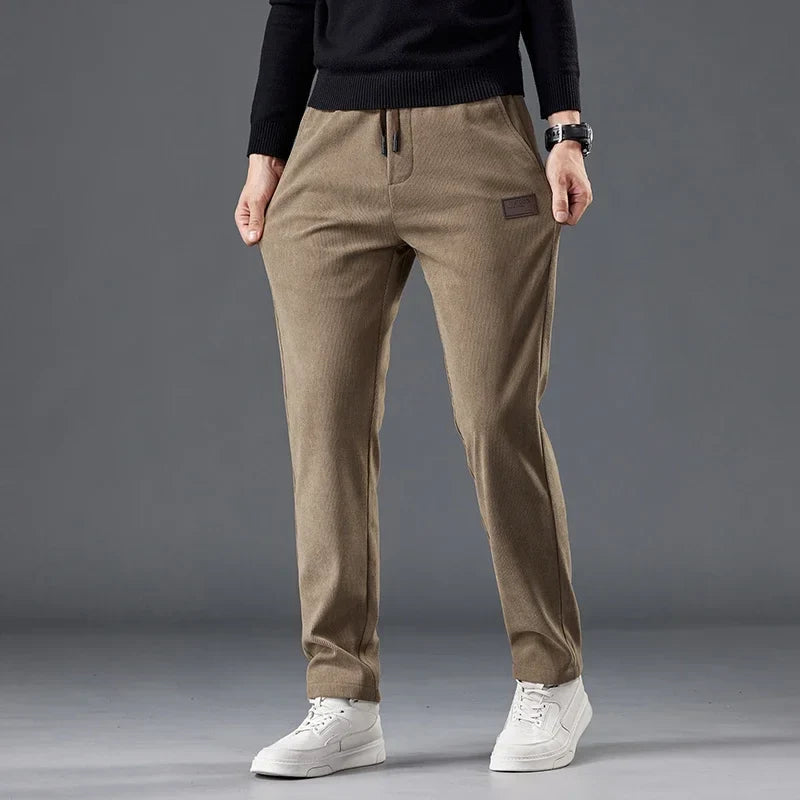 Comfortable slim fit men's drawstring casual pants, wrinkle-resistant for versatile smart-casual style.