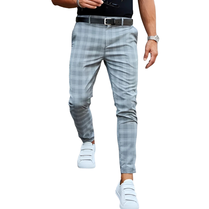 Stylish men's slim fit checked trousers, cropped for a modern aesthetic, ideal for tailored fashion.
