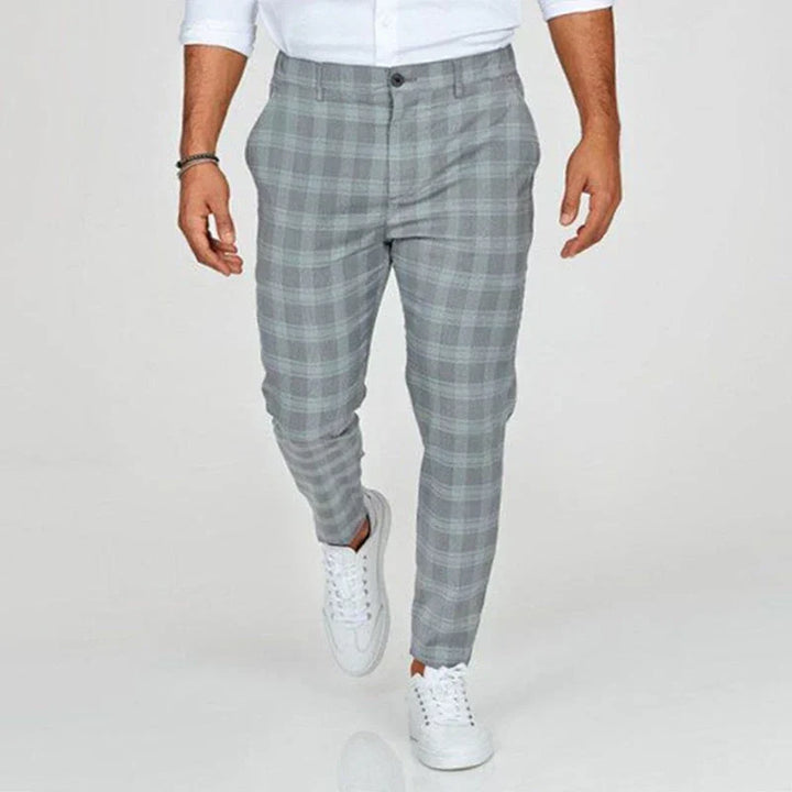 Versatile men's cropped checked pants, slim fit design for both office wear and smart casual occasions.