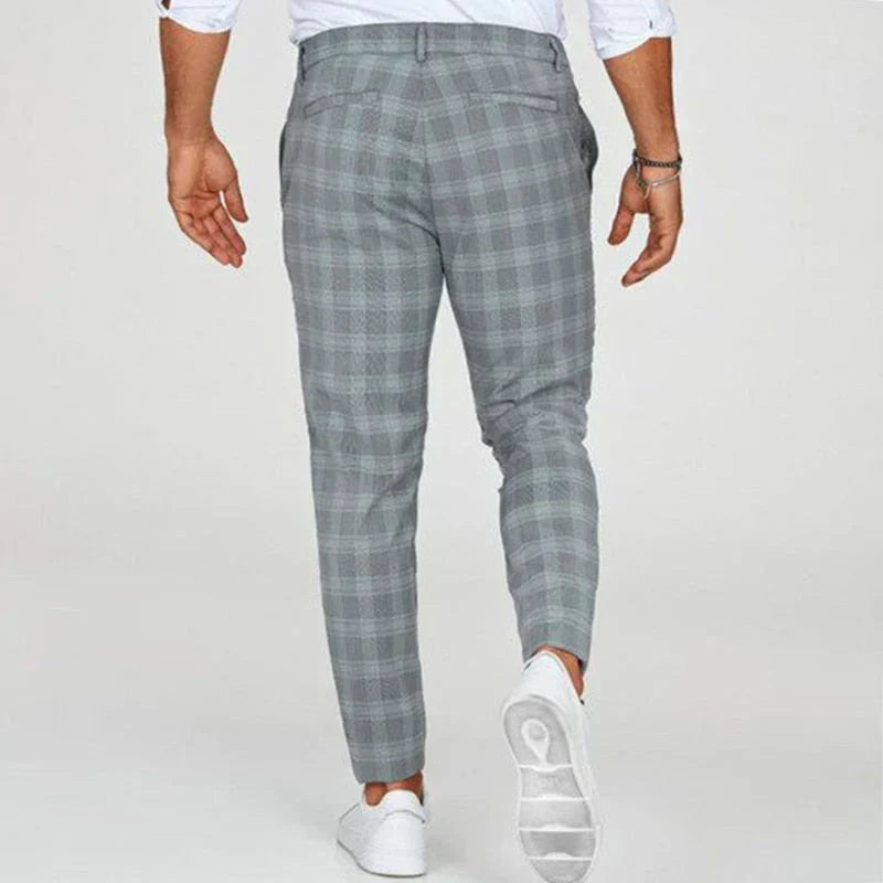 Close-up of men's slim fit cropped checked pants, showcasing the unique pattern & tailored cut.