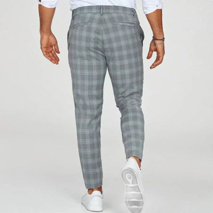 Close-up of men's slim fit cropped checked pants, showcasing the unique pattern & tailored cut.