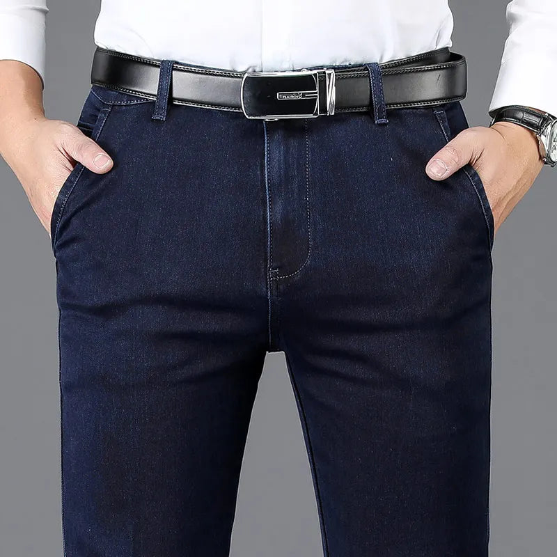 Close-up of flexible stretch denim fabric on men's slim fit trousers, highlighting texture and quality.