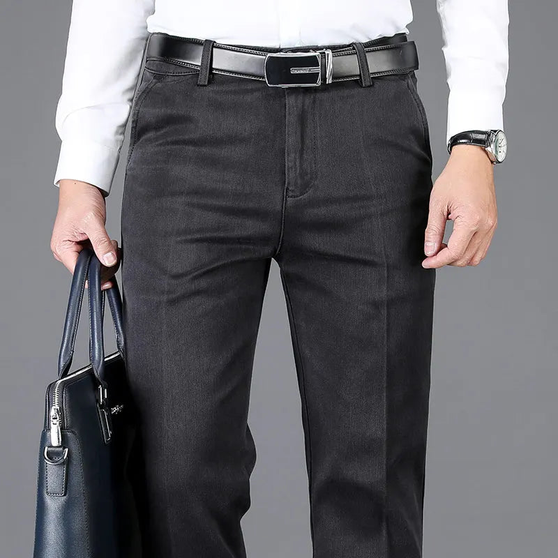 Dynamic shot of comfortable men's versatile slim fit denim trousers with stretch, perfect for active lifestyles.
