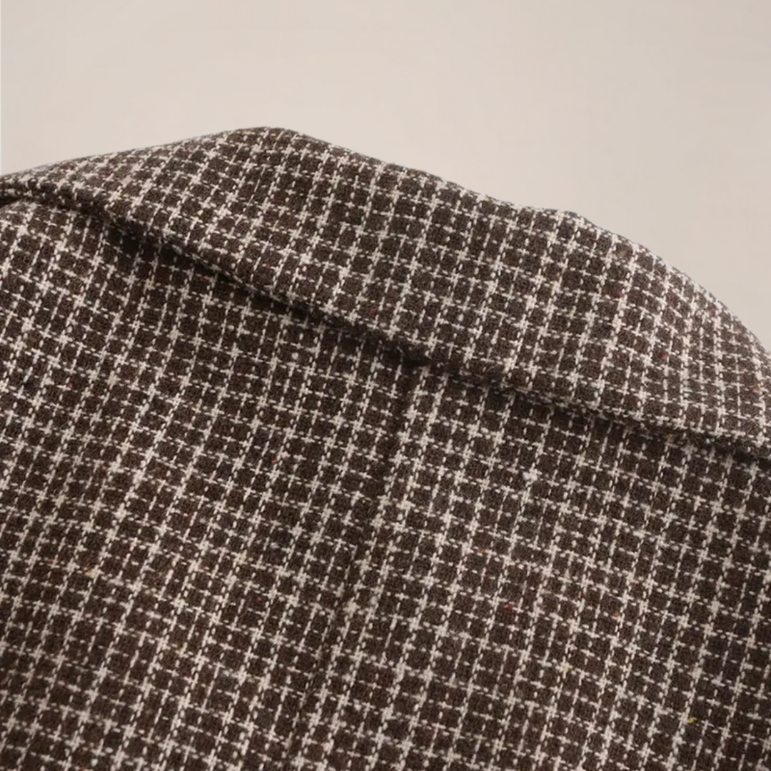 Close-up of men's slim fit check blazer. Double-breasted tailored jacket, perfect for sophisticated smart events.