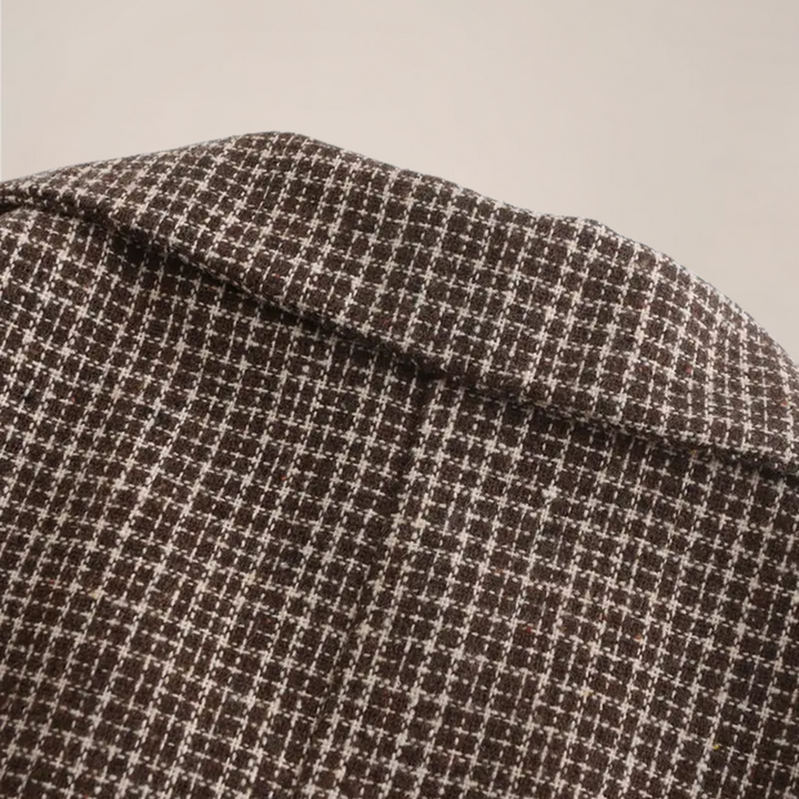 Close-up of men's slim fit check blazer. Double-breasted tailored jacket, perfect for sophisticated smart events.