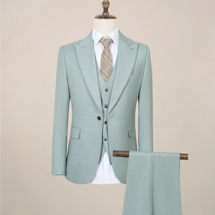 Men's slim fit green three-piece suit, perfect for summer weddings & formal events. Stylish & modern.