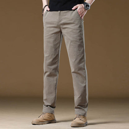 Grey men's comfort slim fit pants, wrinkle-resistant and tailored for a modern professional office look.