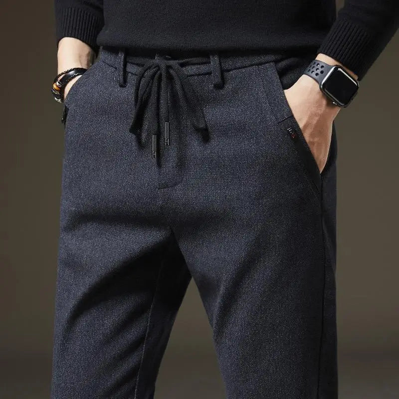 Men's slim fit pants, comfortable & stylish for everyday wear. Wrinkle-resistant drawstring casual pants.
