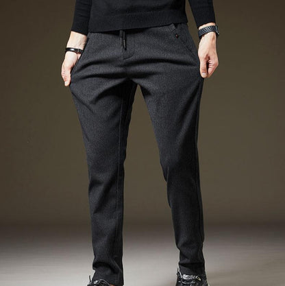 Soft & comfortable men's slim fit pants, versatile for all-day comfort. Wrinkle-resistant for travel.
