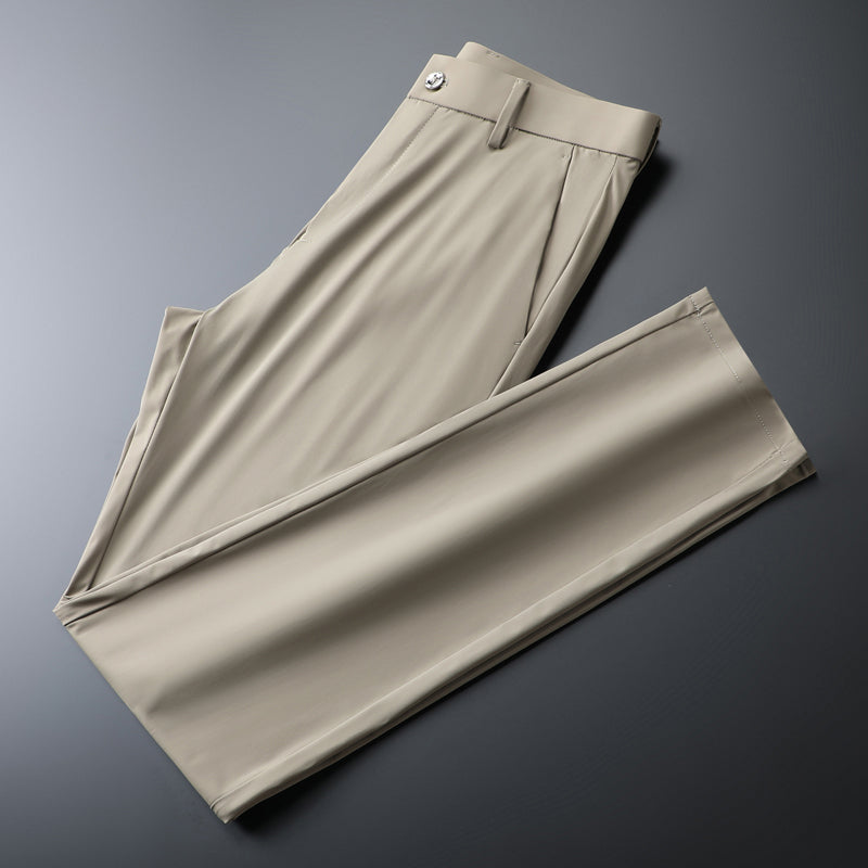 Close-up of performance fabric on men's slim fit dress pants, showing moisture-wicking texture.