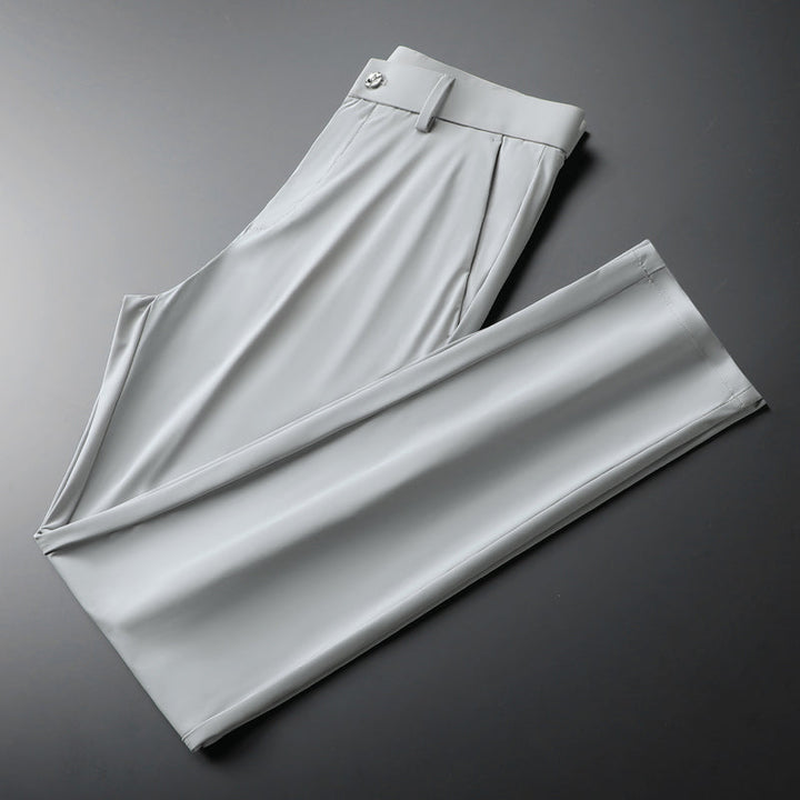Detail of waistband and pockets on men's black slim fit stretch trousers, practical & stylish.