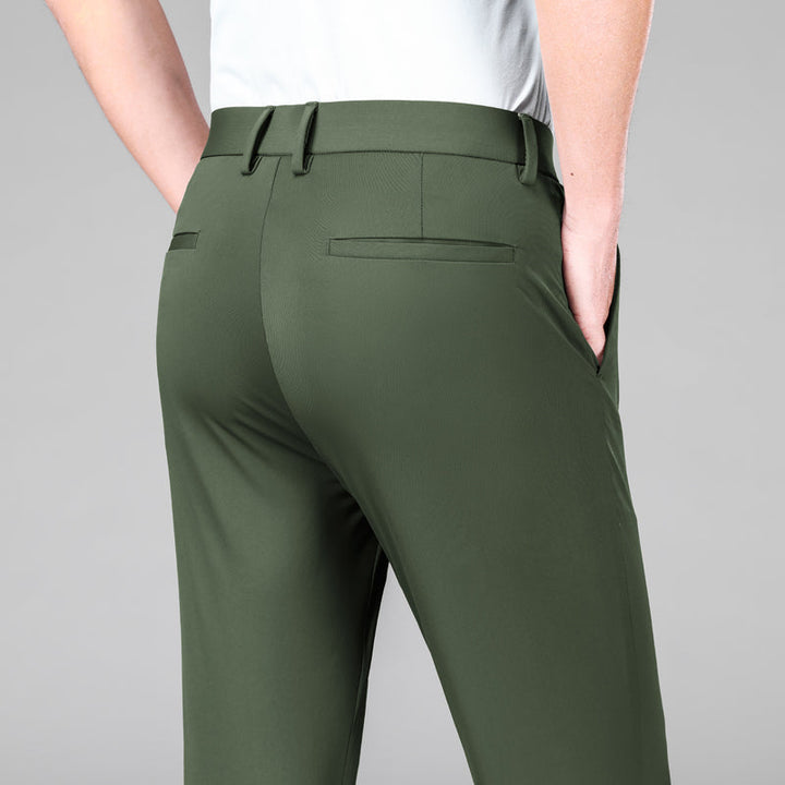 Army green men's slim fit stretch trousers. Versatile performance pants for travel, work, or casual outfits.