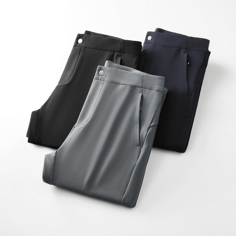 Light gray men's tailored slim fit performance pants, ideal for modern office wear or casual outings.