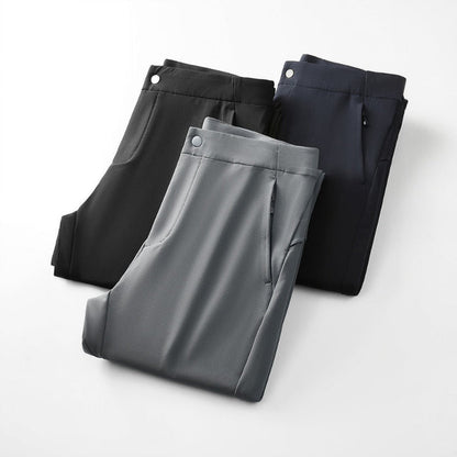 Light gray men's tailored slim fit performance pants, ideal for modern office wear or casual outings.