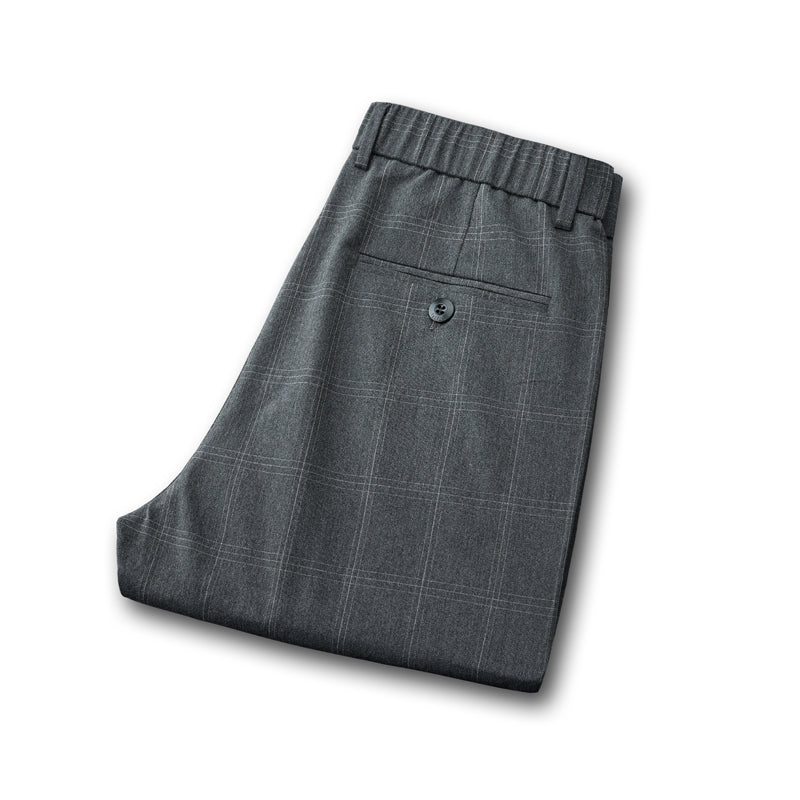 Men's plaid dress pants with a comfortable slim fit, essential for tailored modern business casual.