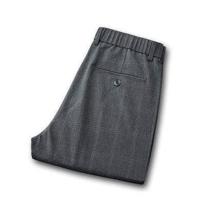 Men's plaid dress pants with a comfortable slim fit, essential for tailored modern business casual.