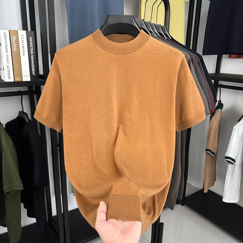 Stylish men's casual slim fit t-shirt with short sleeves and a mock neck, great for summer fashion.