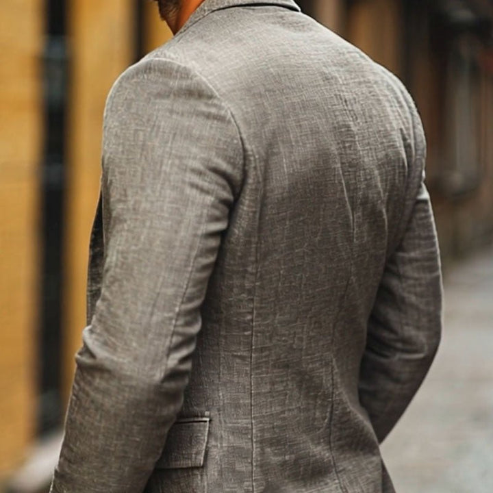 Sleek men's single-breasted blazer with a slim fit cut, perfect for modern smart style. Lightweight and versatile dress jacket.