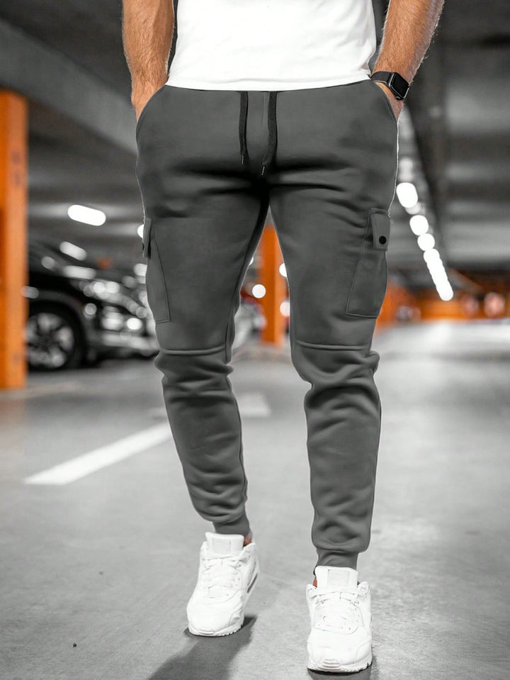 Tapered leg men's pants, comfortable slim fit, ideal for streetwear style.