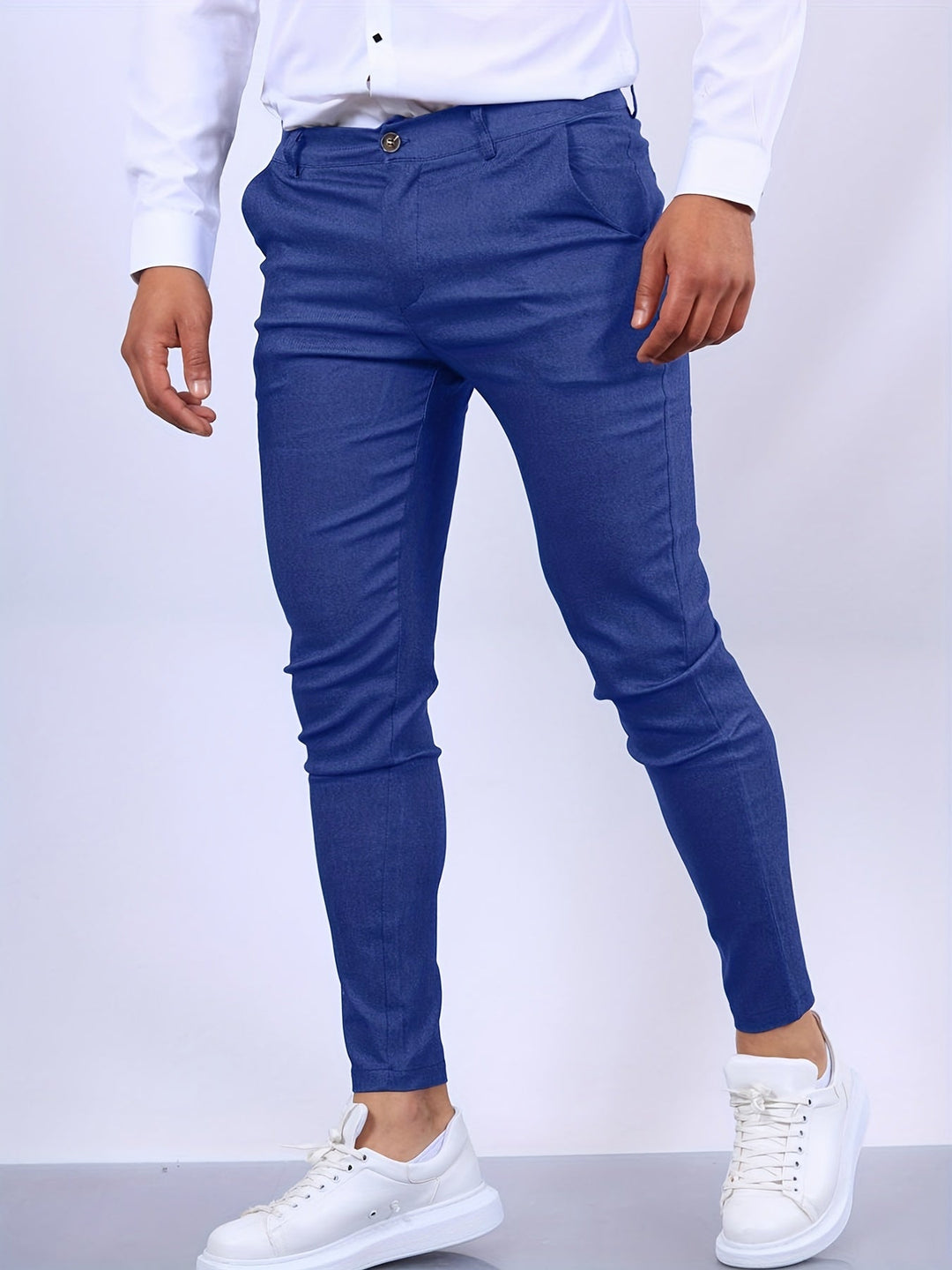 Modern men's slim fit dress chino trousers, offering stretch and a sleek silhouette.