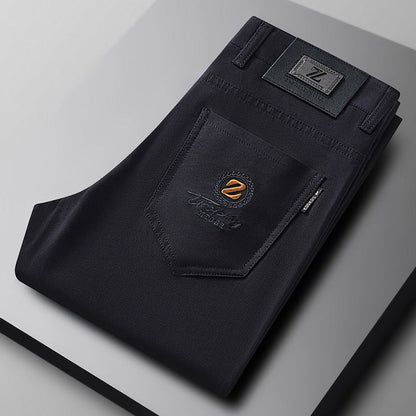 Black slim fit stretch cotton trousers for men, offering ultimate comfort and a sleek, versatile style.