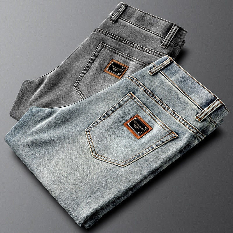 Stylish men's gray slim fit stretch denim pants, perfect for modern casual outfits.
