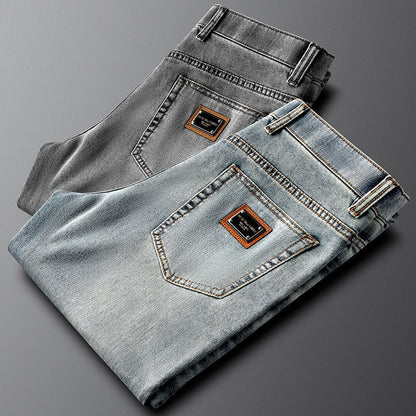 Stylish men's gray slim fit stretch denim pants, perfect for modern casual outfits.