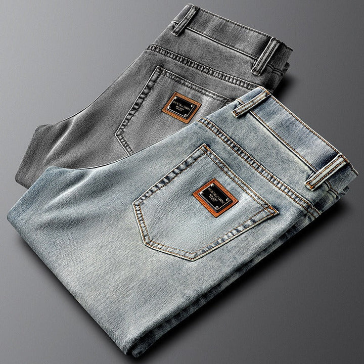 Stylish men's gray slim fit stretch denim pants, perfect for modern casual outfits.