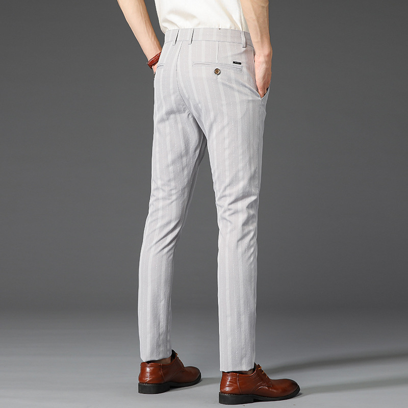 Stylish men's slim fit striped dress pants, suitable for modern office and business attire.