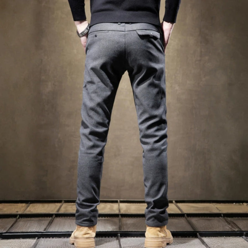 Close-up of men's modern fit tailored pants, showcasing the quality fabric & attention to detail.
