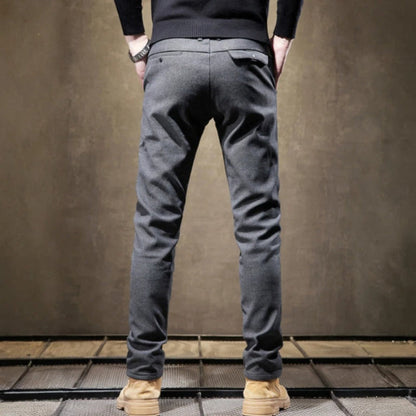 Close-up of men's modern fit tailored pants, showcasing the quality fabric & attention to detail.