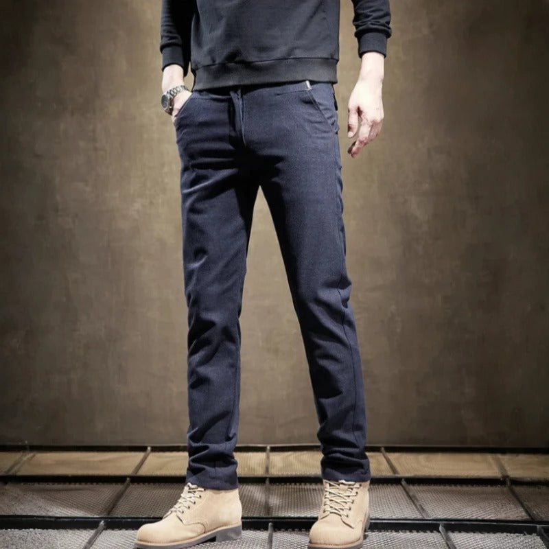 Man wearing modern slim fit tailored pants, demonstrating the sleek fit and comfort for any occasion.